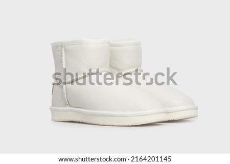 White women's fashion leather winter boots shoes isolated on white background. Pair of Female luxury footwear. Template, mock up Royalty-Free Stock Photo #2164201145
