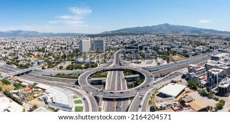 Attiki Odos toll road motorway interchange with Kifisias Avenue in Marousi Attica, Athens, Greece. Aerial drone view of multilevel junction ring road Royalty-Free Stock Photo #2164204571