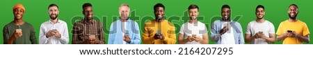 Glad young and old different men in casual typing message on smartphones isolated on green background, studio, free space. New blog, great offer, ad and app, communication during covid-19 pandemic