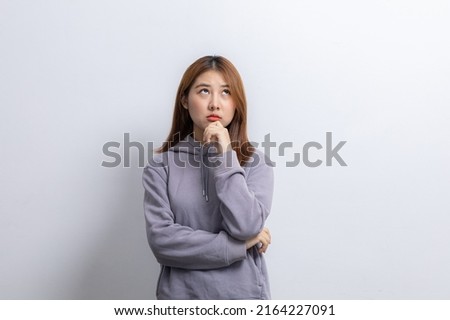Portrait of beautiful Asian woman gesturing surprise on isolated background, portrait concept used for advertisement and signage, isolated over white background, copy space.
