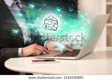 Young man watching stock market on laptop