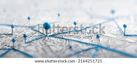 Find your way. Location marking with a pin on a map with routes. Adventure, discovery, navigation, communication, logistics, geography, transport and travel theme concept background. Royalty-Free Stock Photo #2164251721