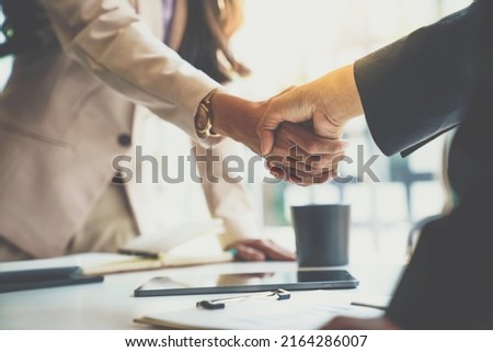 Business partnership meeting concept. Image businessman s handshake. Successful businesswomen handshaking after a good deal. Royalty-Free Stock Photo #2164286007