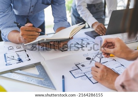 Engineer or architect meeting for project working with partner and engineering tools on model building and blueprint in working site, Construction, contract between two companies structure concept 