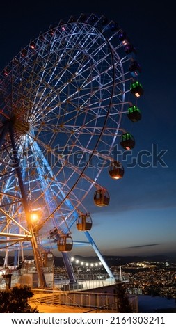 Famous ferris wheel in Mtatsminda amusement park in Tbilisi, Georgia. Illuminated giant wheel at night. Entertainment concept Royalty-Free Stock Photo #2164303241