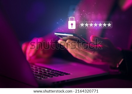 Lock the phone with a password for mobile cybersecurity or a password to confirm login in the online banking application. Cyber security threats. Laptop and smartphone. Royalty-Free Stock Photo #2164320771