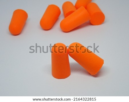 Earplugs - Personal Protective Equipment (PPE) for use when working in noise areas with blur background