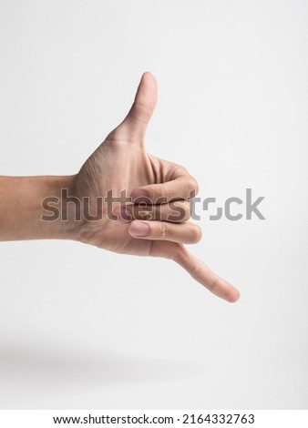 Closeup of hand gesture showing hand span isolated on white background Royalty-Free Stock Photo #2164332763