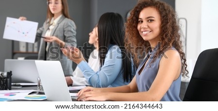 Women discussing issue at business meeting in office