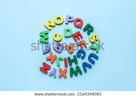 Colorful letters on blue background. Alphabet concept