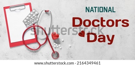 Modern stethoscope, clipboard, red heart and pills on light background. National Doctors Day Royalty-Free Stock Photo #2164349461