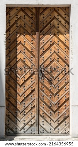 Old vintage decorative door. Abandoned architecture.