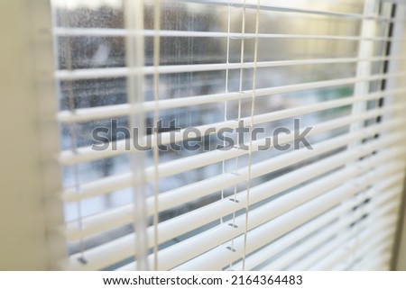 Metal blinds on the window. The texture of blinds. Blinds background.
