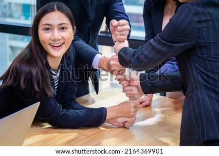 Successful and teamwork concept, Business people team joining hands after meeting in modern office Royalty-Free Stock Photo #2164369901