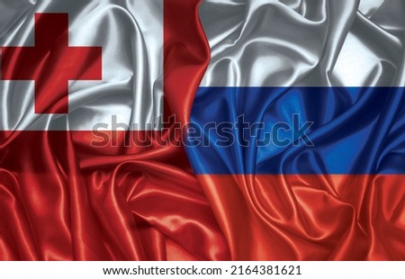 Tonga and Russian two folded silk flags together