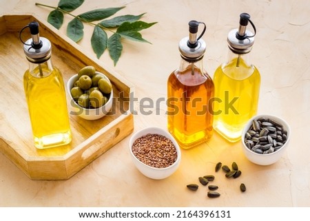 Three types of cooking oil - sunflower olive and sesame oil Royalty-Free Stock Photo #2164396131