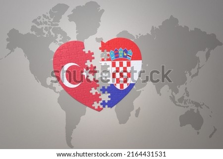 puzzle heart with the national flag of turkey and croatia on a world map background. Concept. 3D illustration
