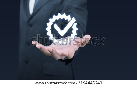 Quality assurance of business services, Businessman Hand shows the sign of the top service Quality, Guarantee, Standards, ISO certification and standardization concept.