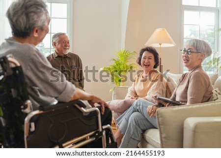 old senior asian friends retired people hapiness positive laugh smile conversation together at living room at nursing home Seniors participating in Group Activities in Adult Daycare Center  Royalty-Free Stock Photo #2164455193