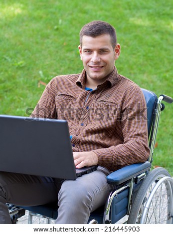 Picture of a handicap businessman with his wheelchair