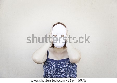 Girl in white mask on halloween, mystery