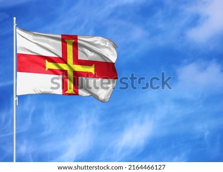 National flag of Guernsey on a flagpole