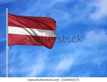 National flag of Latvia on a flagpole
