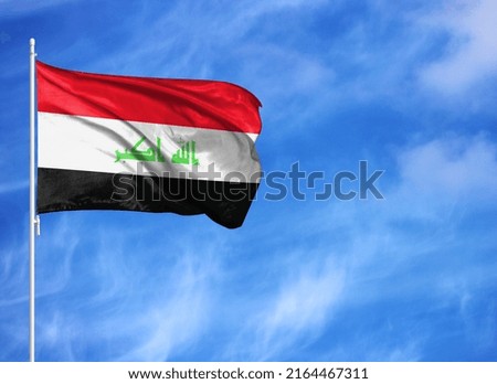 National flag of Iraq on a flagpole