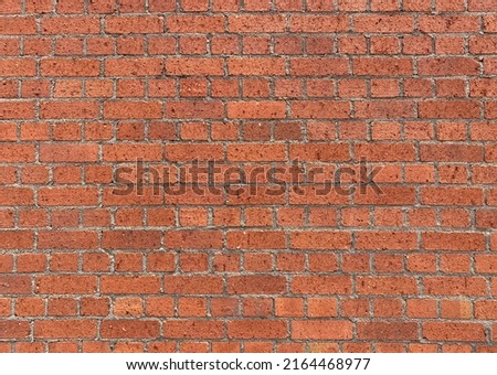 Old red brick wall for background