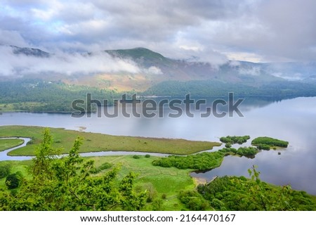 View down Derwent Water towards Keswick in the early morning with low lying cloud Royalty-Free Stock Photo #2164470167