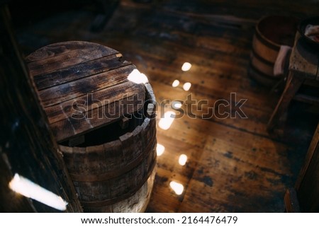 Wooden winch of a sailing ship and ropes on the deck of medieval pirate warship