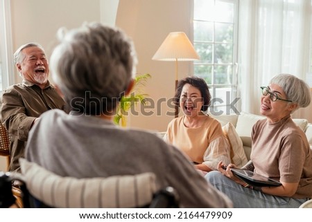 old senior asian friends retired people hapiness positive laugh smile conversation together at living room at nursing home Seniors participating in Group Activities in Adult Daycare Center Royalty-Free Stock Photo #2164479909