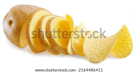 Raw potato cut on slice which are turning into delicious potato chips. Conceptual picture.