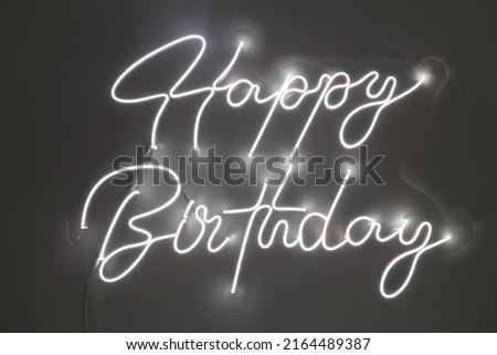 White neon happy birthday. Trendy style. Happy Birthday  background. Neon sign. Custom neon. Party decor.