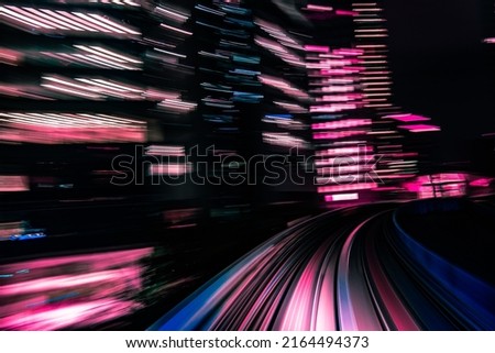 Long exposure motion blur from Yurikamome Monorail line in Tokyo, Japan. Abstract for Digital, Metaverse Technology, Futuristic Transportation, Computer Network, and Communication concept.
