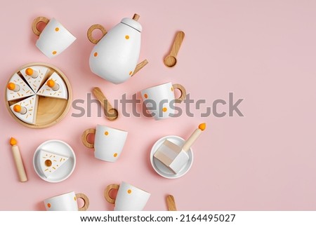 Children's tea set and cake with candles. Cute kids toys to play in the kitchen. Wooden play set. Educational toys. 