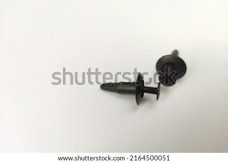 Plastic bolts on a white background. Selective focus.