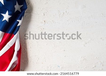American Flag close up on white background for Memorial Day or 4th of July. Flag Day. National patriotic holiday. Greeting card or banner for a website or store sale. Layout. Top view.