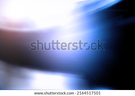 Abstract blue background. Blurred background curved lines blue tint.
