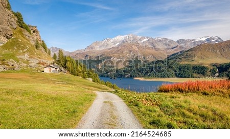 The hiking trail from Plaun da Lej to Grevasalvas (part of via engiadina) offers great views on Lake Sils and the Upper Engadine Valley (Switzerland). Royalty-Free Stock Photo #2164524685