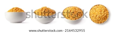 yellow split peas in a white bowl or cup, dried, peeled and split seeds of pea, isolated on white background, taken in different angles, collection Royalty-Free Stock Photo #2164532955