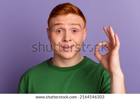 Photo of young man show fingers okey symbol approve decision feedback isolated over violet color background