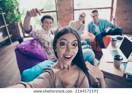 Portrait of friendly positive partners take selfie record video prepare together test exam loft room indoors