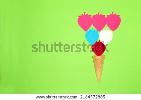 ice cream cone with paper colorful strawberry, creative summer design, art colorful minimalism