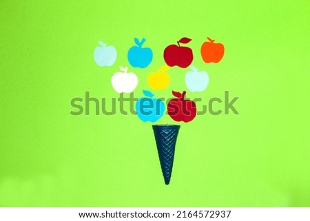 blue ice cream zone with paper colorful apples, creative summer design, art colorful minimalism