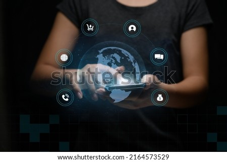 Woman using mobile smartphone on global network connection to shopping icon application. Technology and digital marketing internet of things.