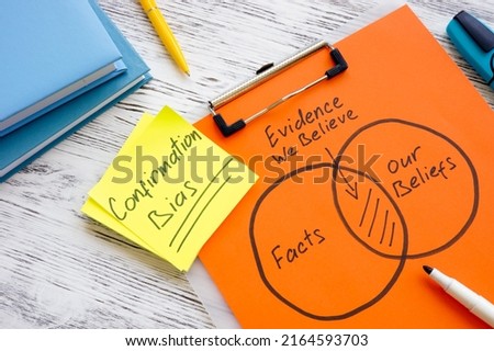 Papers with how confirmation bias works and a pen. Royalty-Free Stock Photo #2164593703
