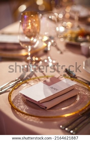 Table set for wedding or another catered event dinner. Royalty-Free Stock Photo #2164621887