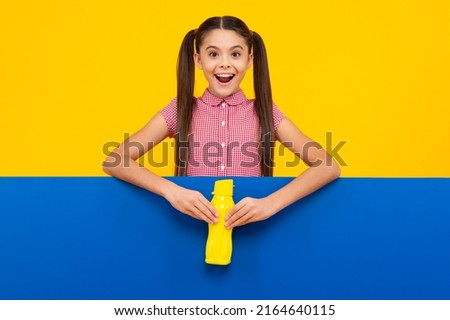 Amazed teenager. Child teen with water bottle isolated studio background. Water bottle and healthy life. Health and water balance. Excited teen girl.