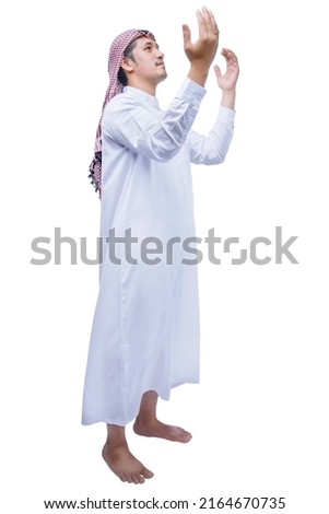 Muslim man with keffiyeh with agal raised hands and praying isolated over white background